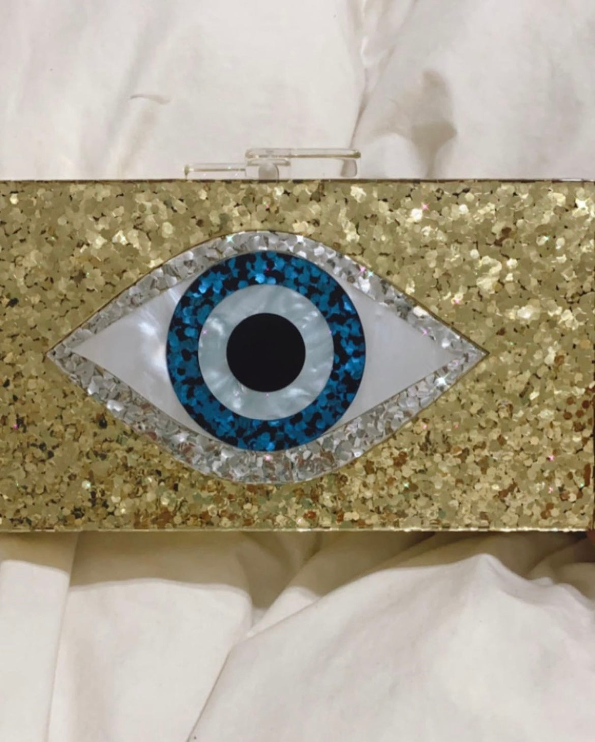 Gold eye clutch