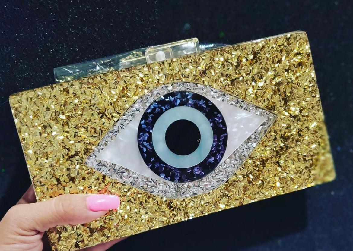 Gold eye clutch